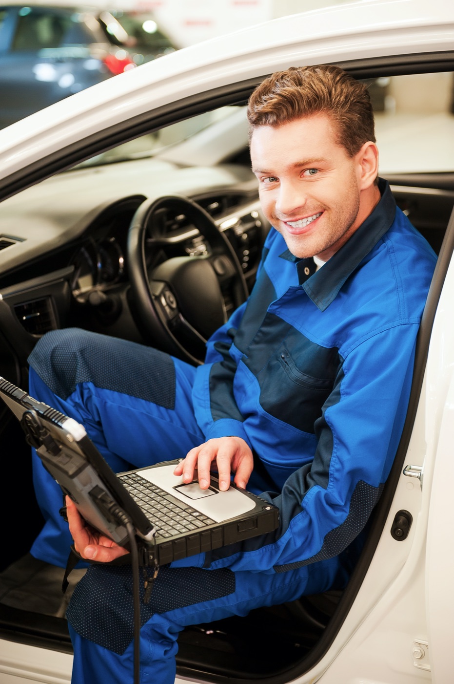 Mechanic running a diagnostic scan in an Australian workshop